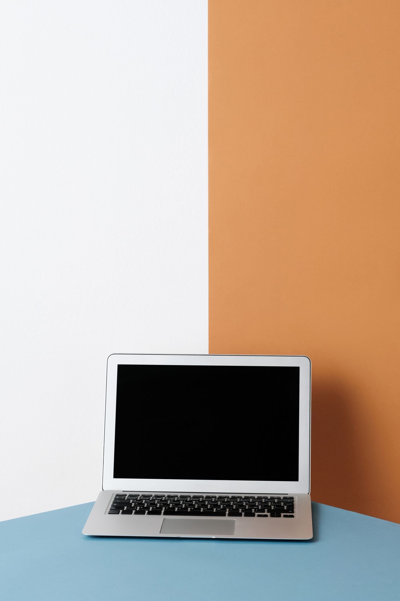 A laptop on a blue surface — illustrative photograph